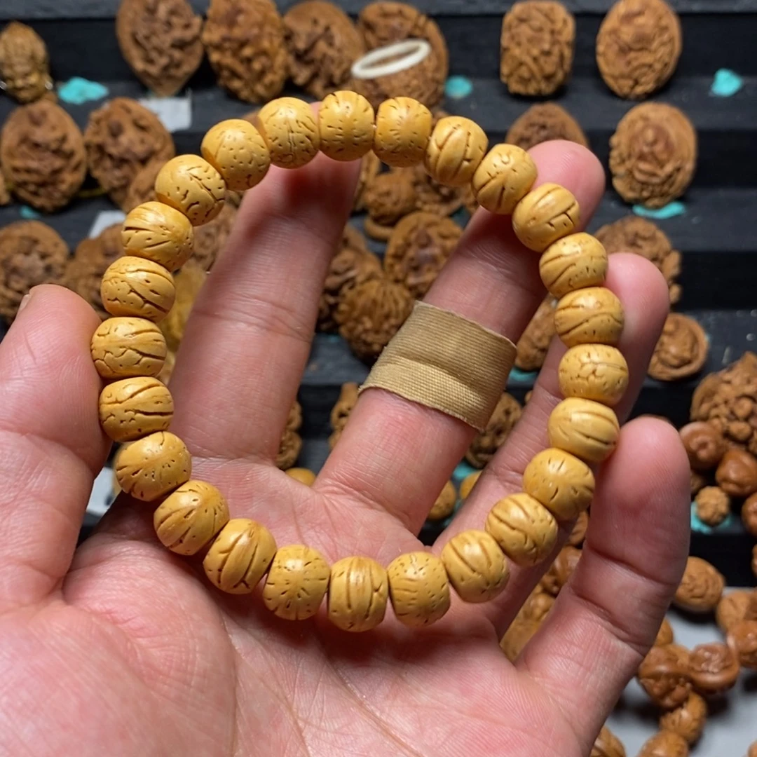 生***水盘锦奶油皮桃核手串