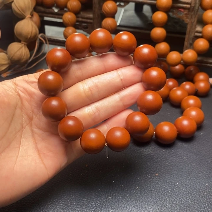 橄榄核手串1.95尺寸树王鸡血红光珠