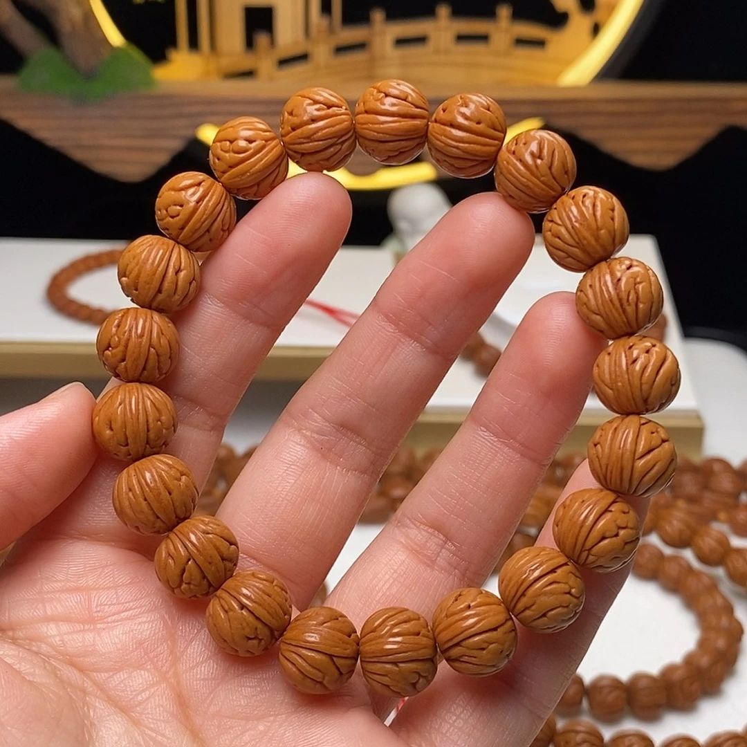 J***n桃核手串11mm野生金麒麟桃核手串