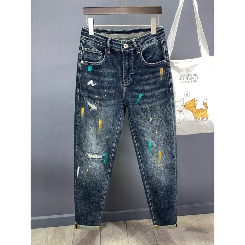 高端潮流泼墨破洞牛仔裤男修身小脚2025秋冬新款弹力柔软百搭长裤