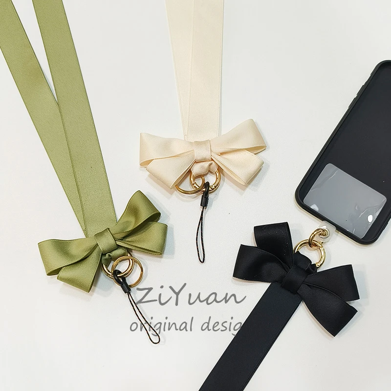 小众纯色ins风可拆卸蝴蝶结挂脖子绳手机贴夹片结实手腕短布带女