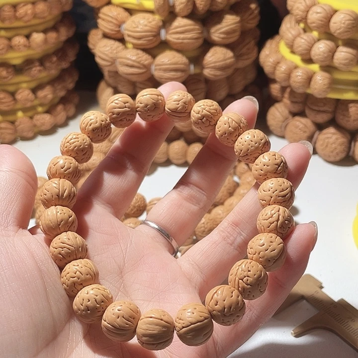 狮***座桃核吊坠桃核手串野生。 45