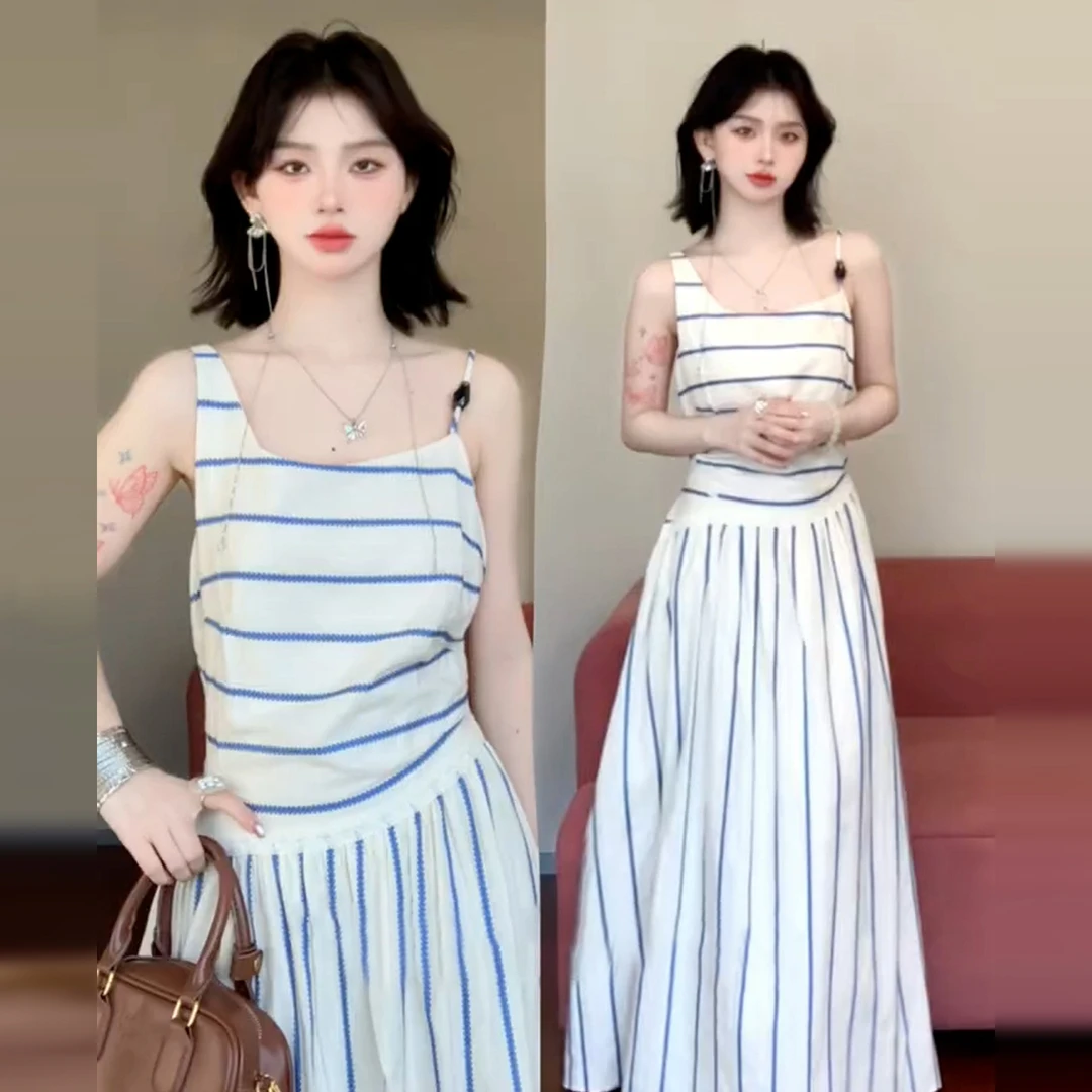 海边度假蓝色条纹吊带连衣裙子女2025新款夏季黑色长款修身连衣裙