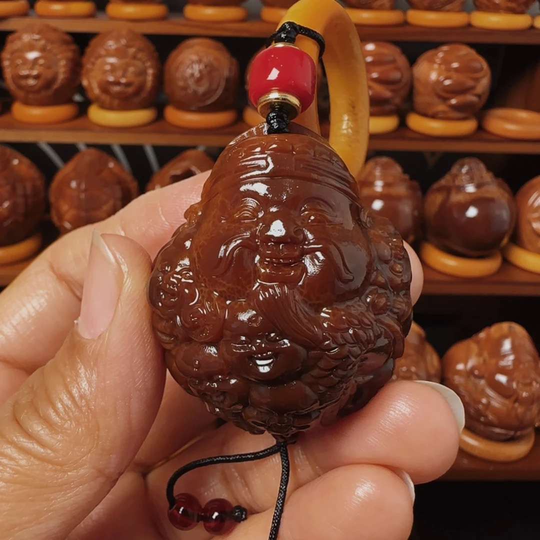 橄榄核把件用****5玉华九子龙财手把件37