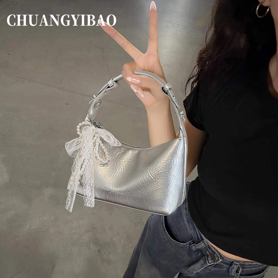 高级感小众手提包包女2025新款时尚百搭简约斜挎包韩版休闲饺子包