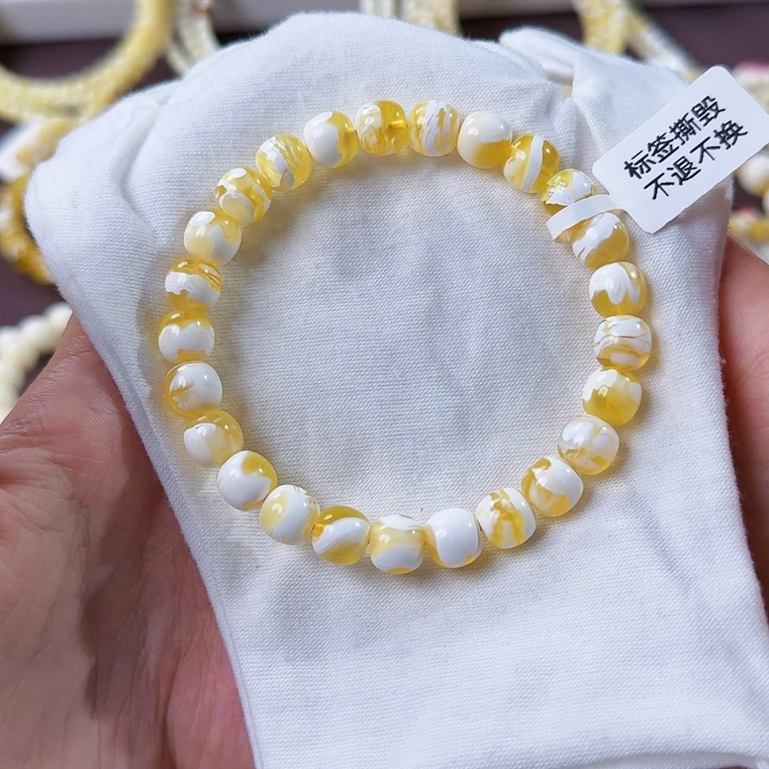 琥珀未镶嵌裸石8.5mm金瓷白溶洞