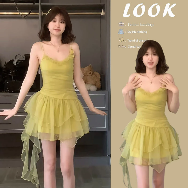 夏季温柔系穿搭女2025新款减龄不规则裙摆度假风纯欲吊带连衣裙女