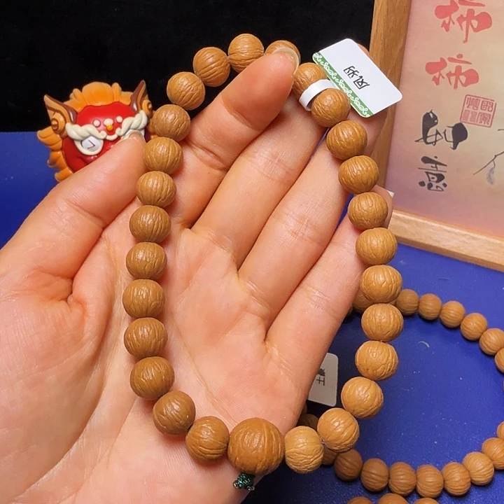 沐***蓝吊坠猴头核桃凤羽