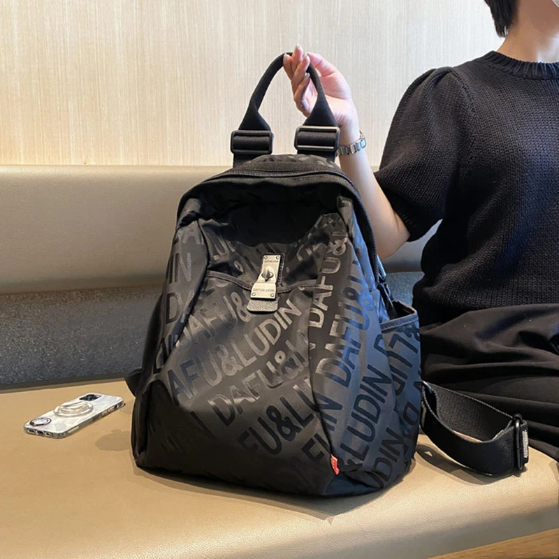 新款2025轻便旅游大容量字母双肩包女包多功能潮牌背包旅行登山包