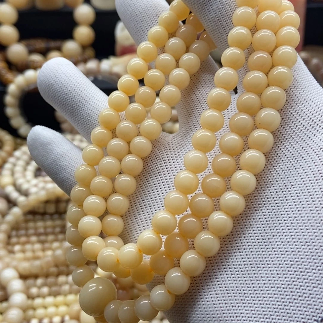 驼骨手串/手链8毫米黄透108