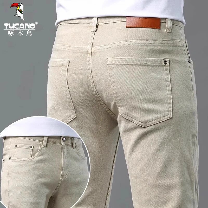 啄木鸟高端卡其色牛仔裤男士2025秋季新款修身小脚百搭弹力长裤男
