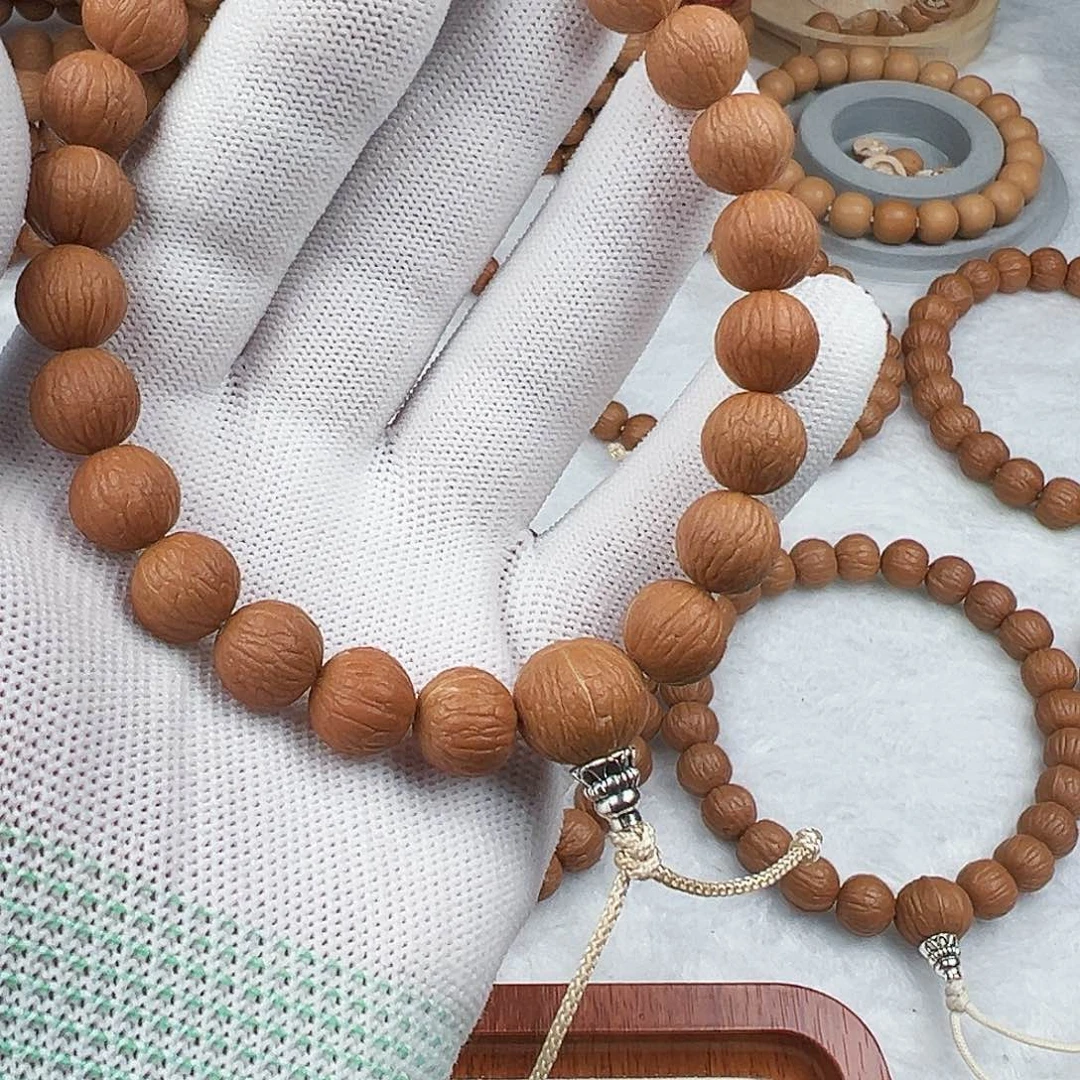 吞***兽猴头核桃手串凤羽