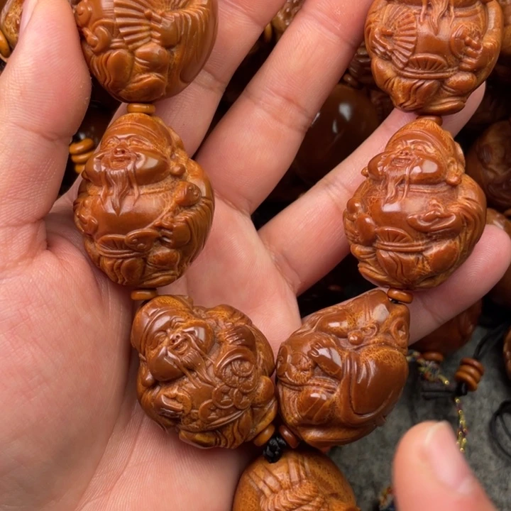 橄榄核手串辉**.橄榄核手持