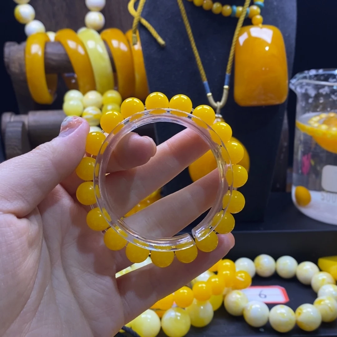 朵***️非金属鸡油黄卡10手串全品