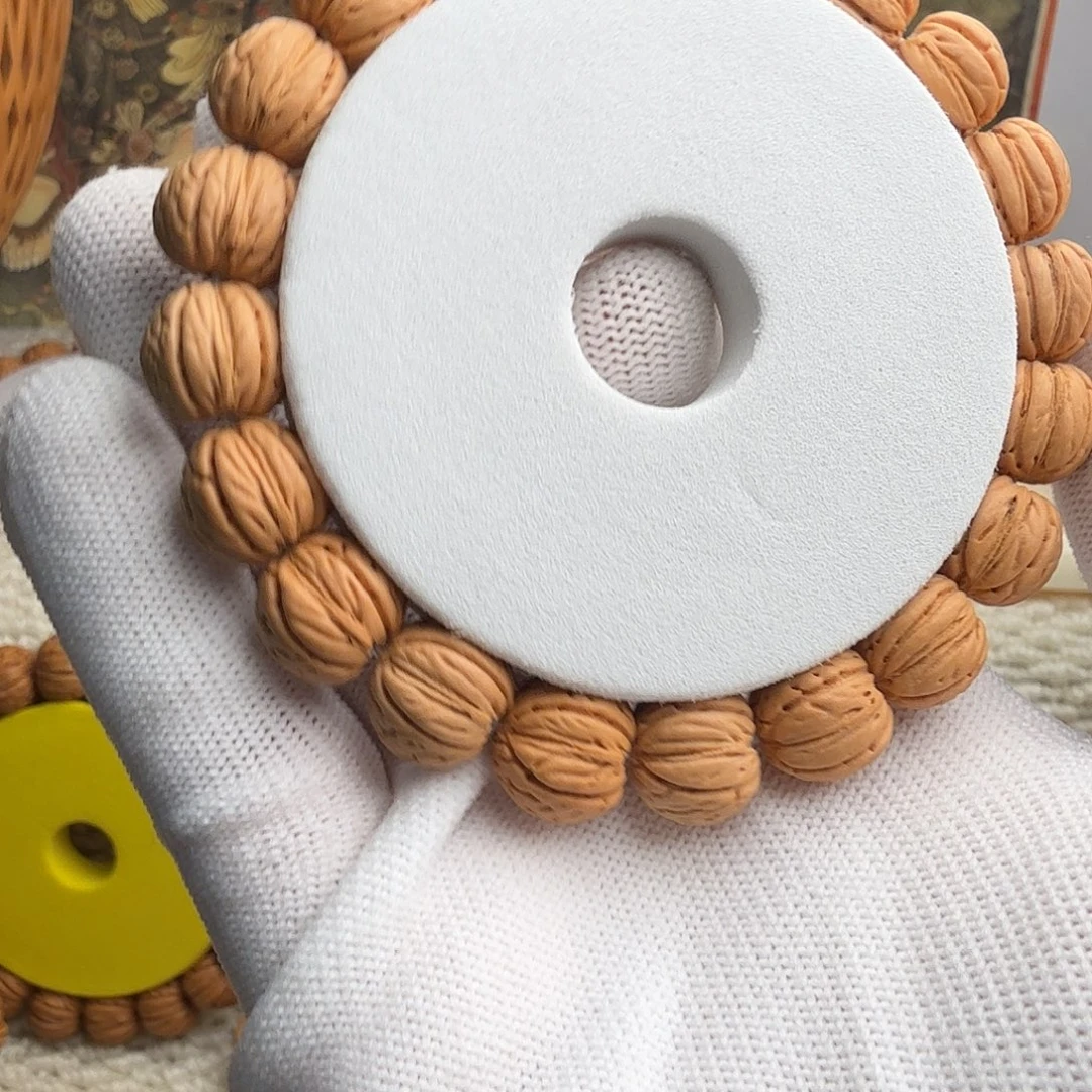 H***6桃核吊坠1.25金丹手串