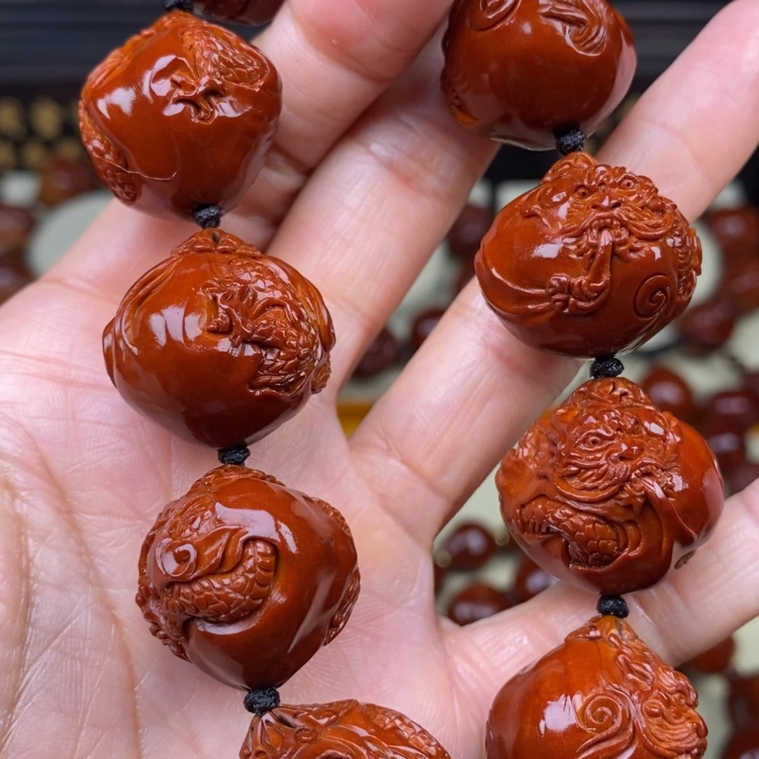 自***风橄榄核吊坠九龙九龙