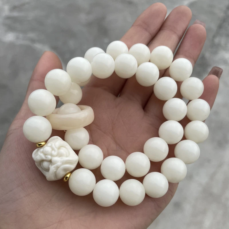 P65白玉菩提卡1.2带醒狮配饰手持