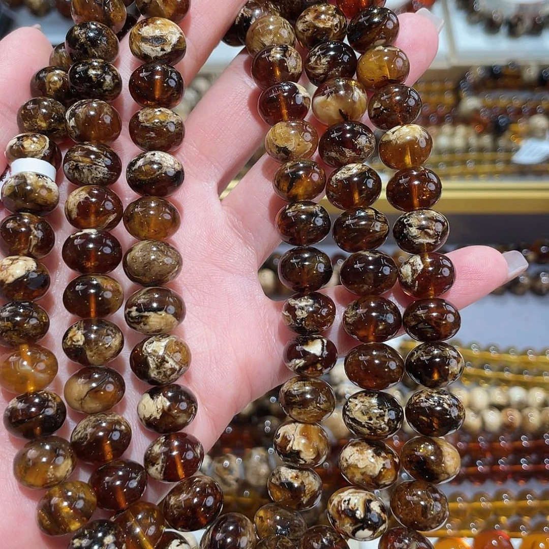 笙***谅琥珀未镶嵌颈饰11m花