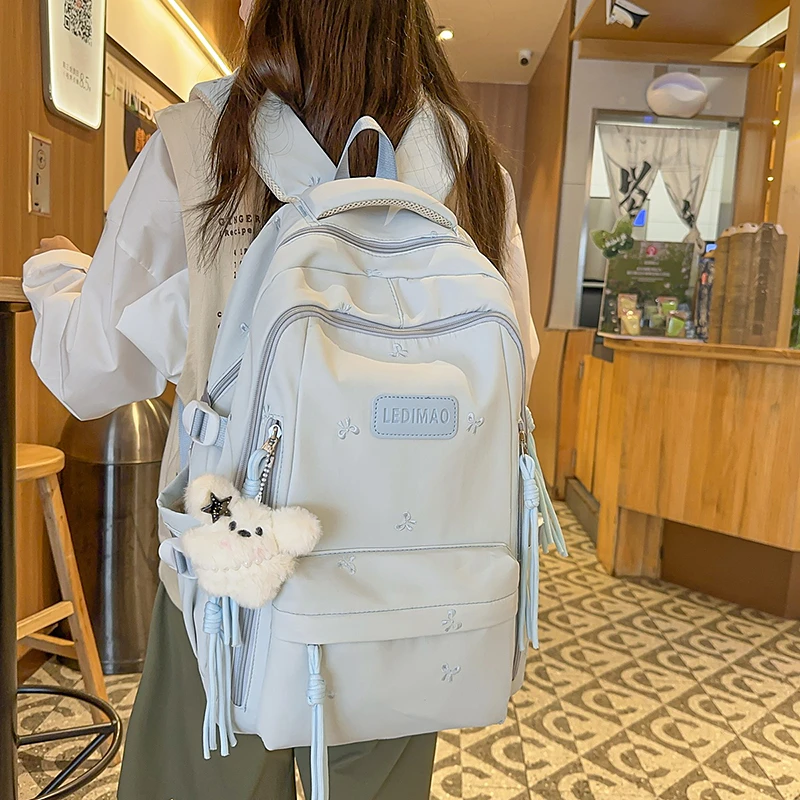 书包女生小学生2025新款简约大容量初中生高中生多层轻便双肩背包