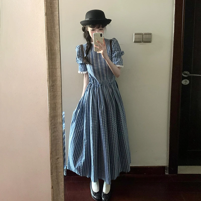 蓝色格子连衣裙子女夏季2025新款法式高级感气质海边度假收腰长裙