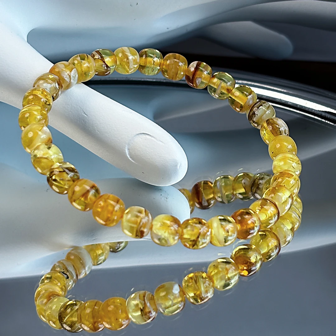 蜜蜡金底拉丝老型手串7*6.5MM