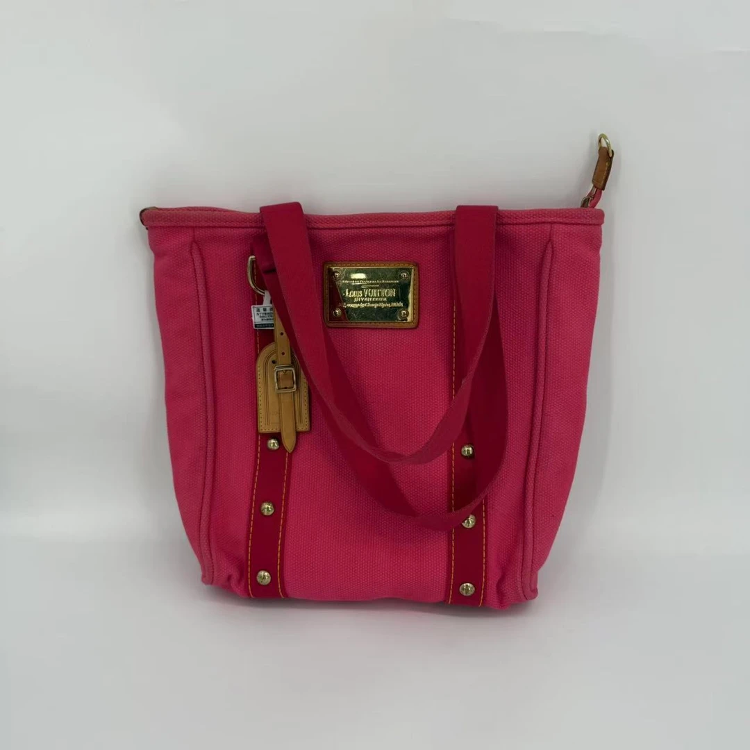 99新 LouisVuitton/路易威登 lv红色铆钉帆布袋手提包