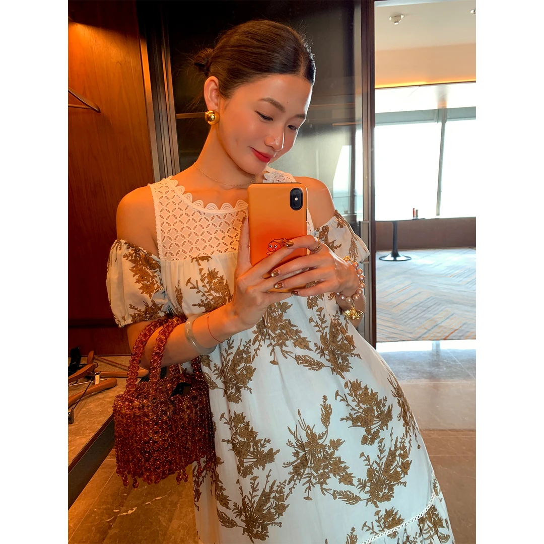 落落狷介连衣裙女夏2025新款设计感背带一字肩天丝苎麻裙子假两件