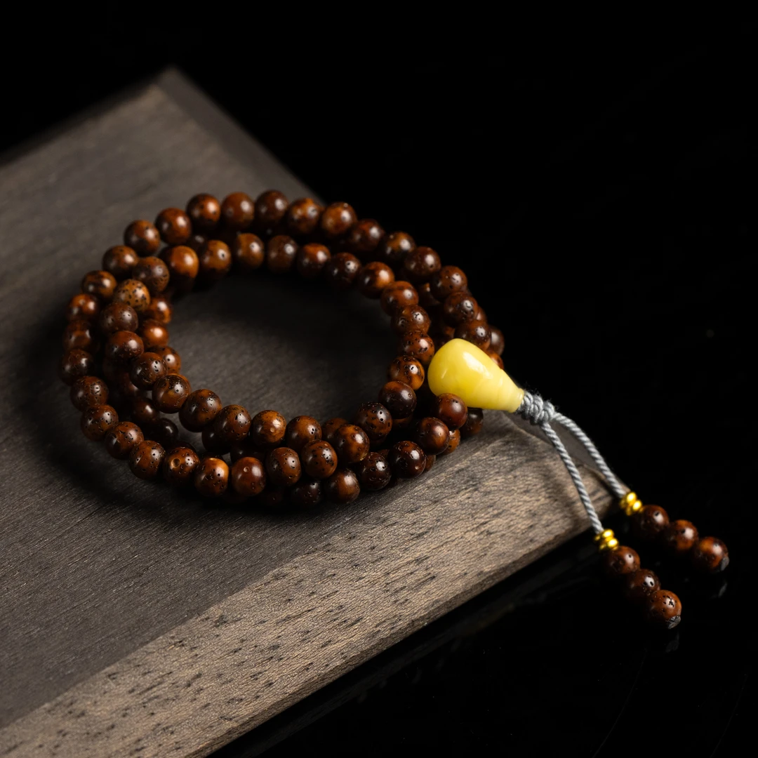 酸儿文玩·精工级中珀星月老陈籽圆珠6长串