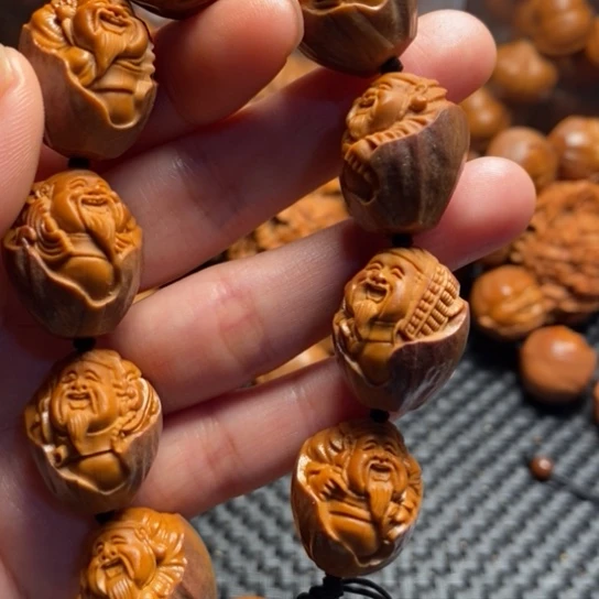 橄榄核吊坠家***万紫皮财神