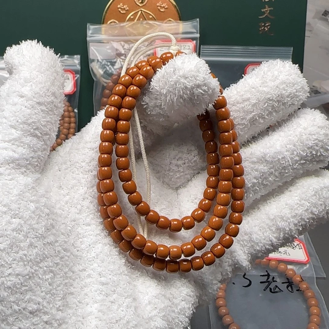 橄榄核吊坠5.7mm老挝红料高桩核尖长串毕业级无白