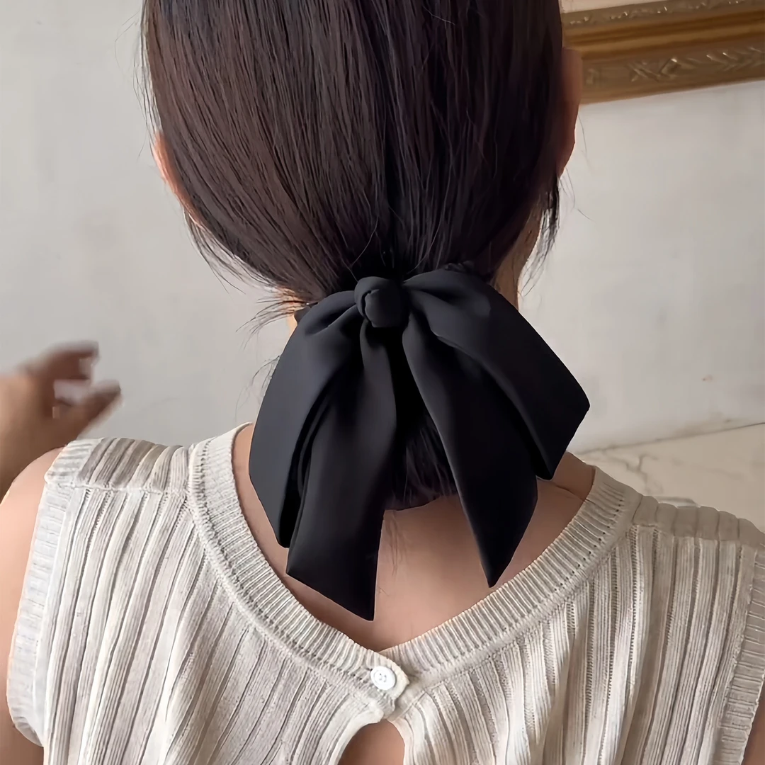 女低丸子头弹簧缎面蝴蝶结黑色夹头饰2025新款后脑勺马尾发夹纯色