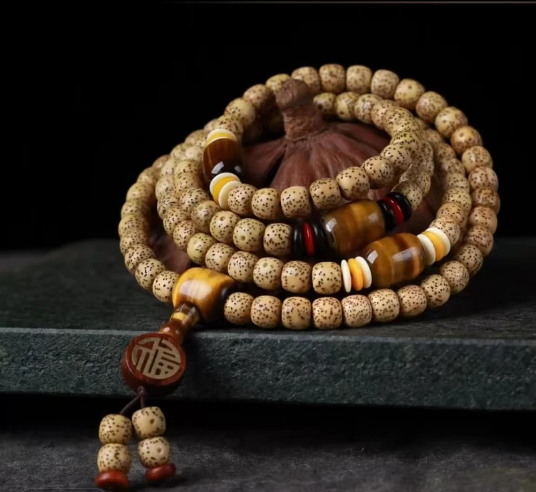 6*8鸡油黄星月菩提108颗虎睛石福牌款