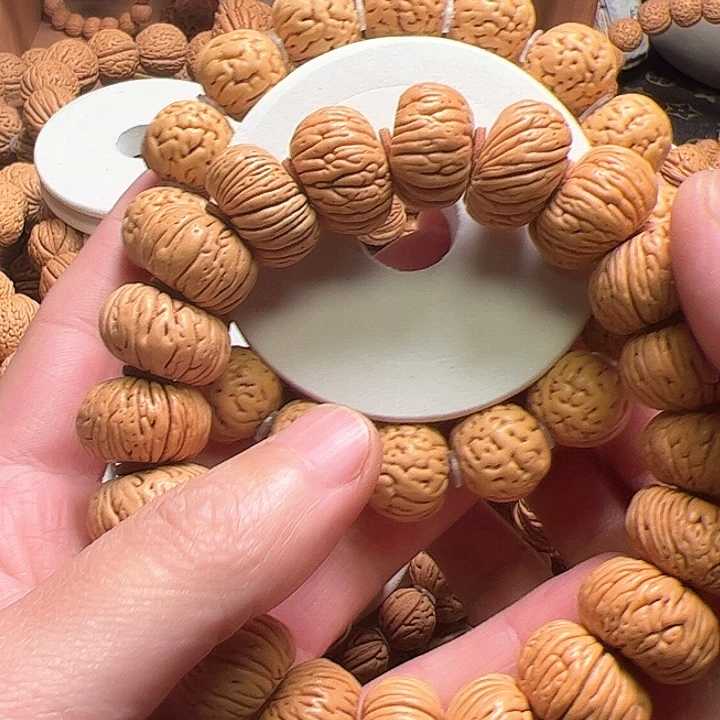 桃核手串丰****车肌肉金豆桃核手串16+尺