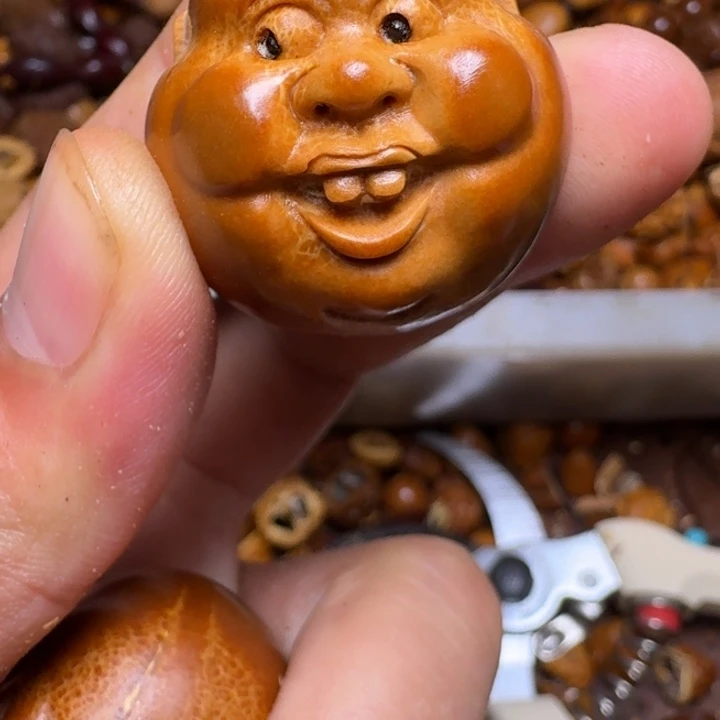 把件橄榄核你的电话