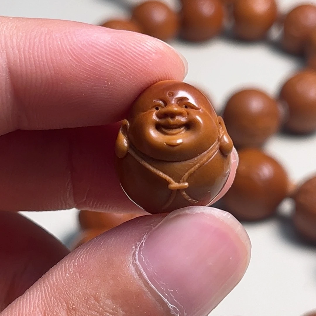 和***下橄榄核吊坠小子弥勒