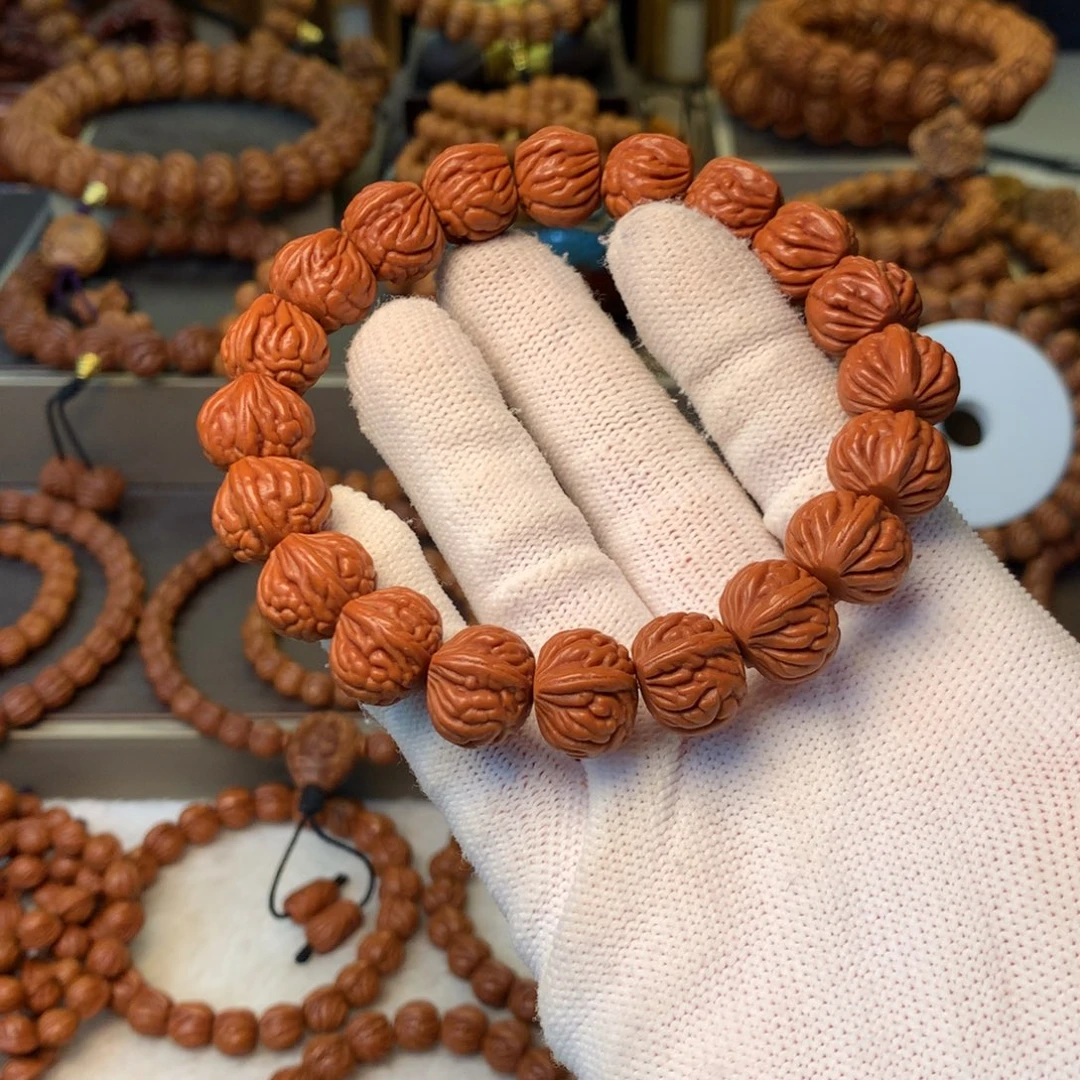 孙***生桃核手串秦岭龙纹