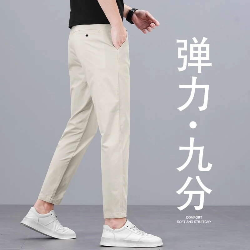 香港夏季米白色九分休闲裤男士修身百搭直筒外穿潮流弹力9分裤子