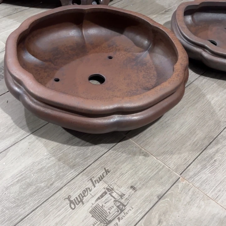 许***)紫砂花盆宜兴紫砂工艺厂。