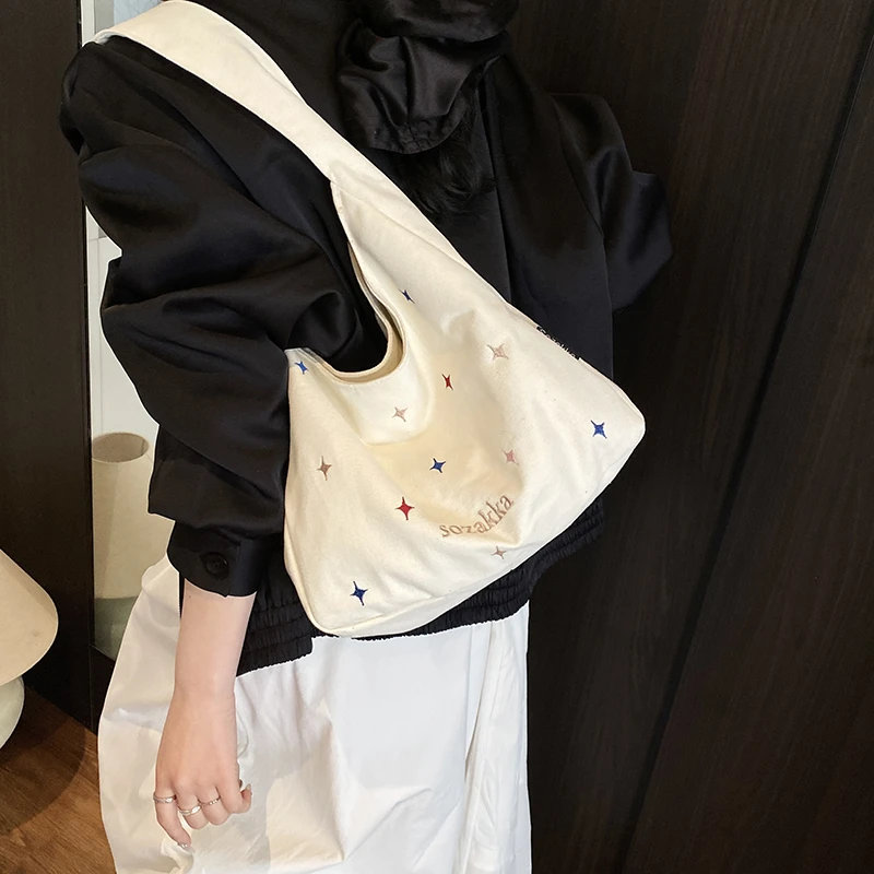 休闲大容量帆布包女2025新款夏季通勤百搭单肩包流行小清新托特包