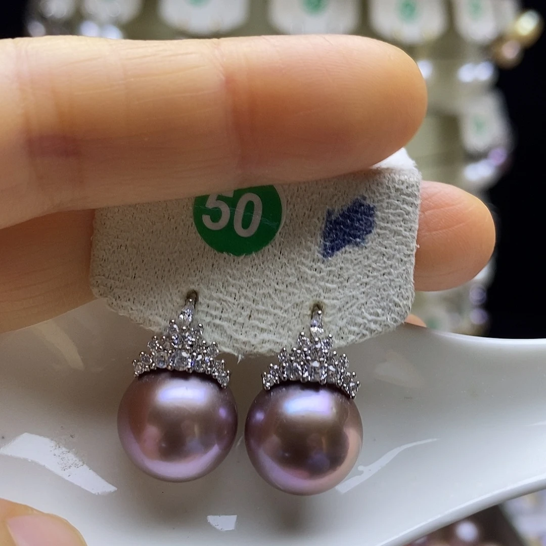 雨****淡水珍珠银S925镶嵌耳饰