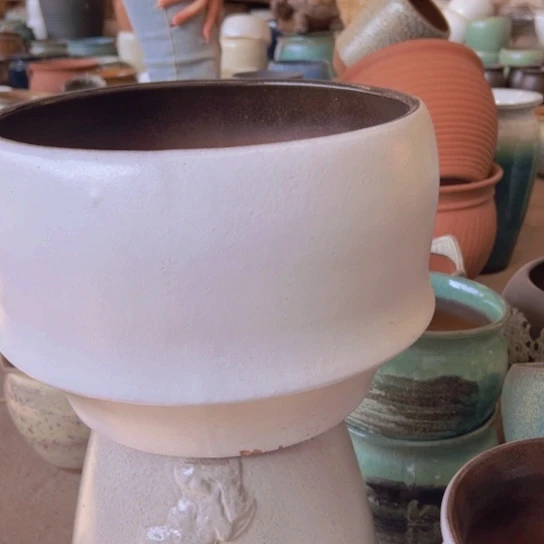 紫砂花盆高21口29。