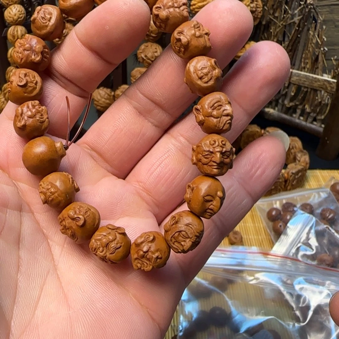 王****首纯手工雕刻龙纹桃核应化十八罗汉一物一图