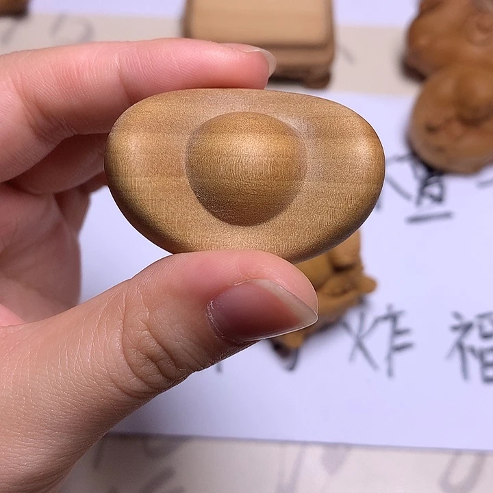 啊***咿檀香木小元宝摆件