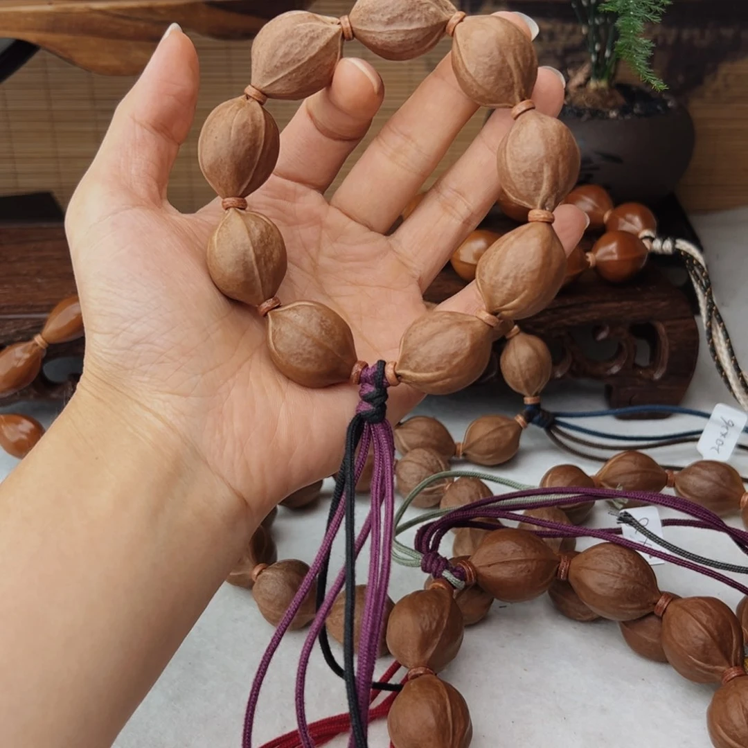 橄榄核手串21*27三花核串