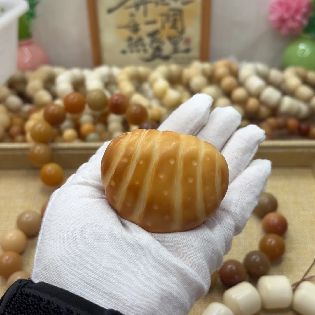 吊坠菩提根/象牙果牙果牛角包把件553