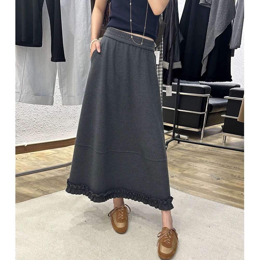 轻奢风时尚气质黑色半身裙2025秋季新款韩版木耳设计拼接A字伞裙