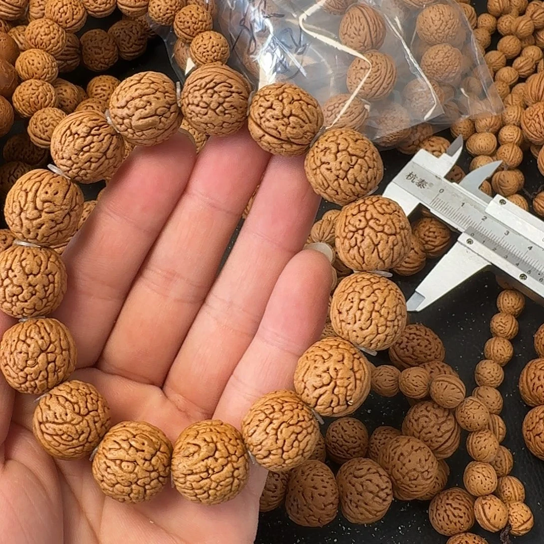 余***康桃核吊坠荔枝纹手串