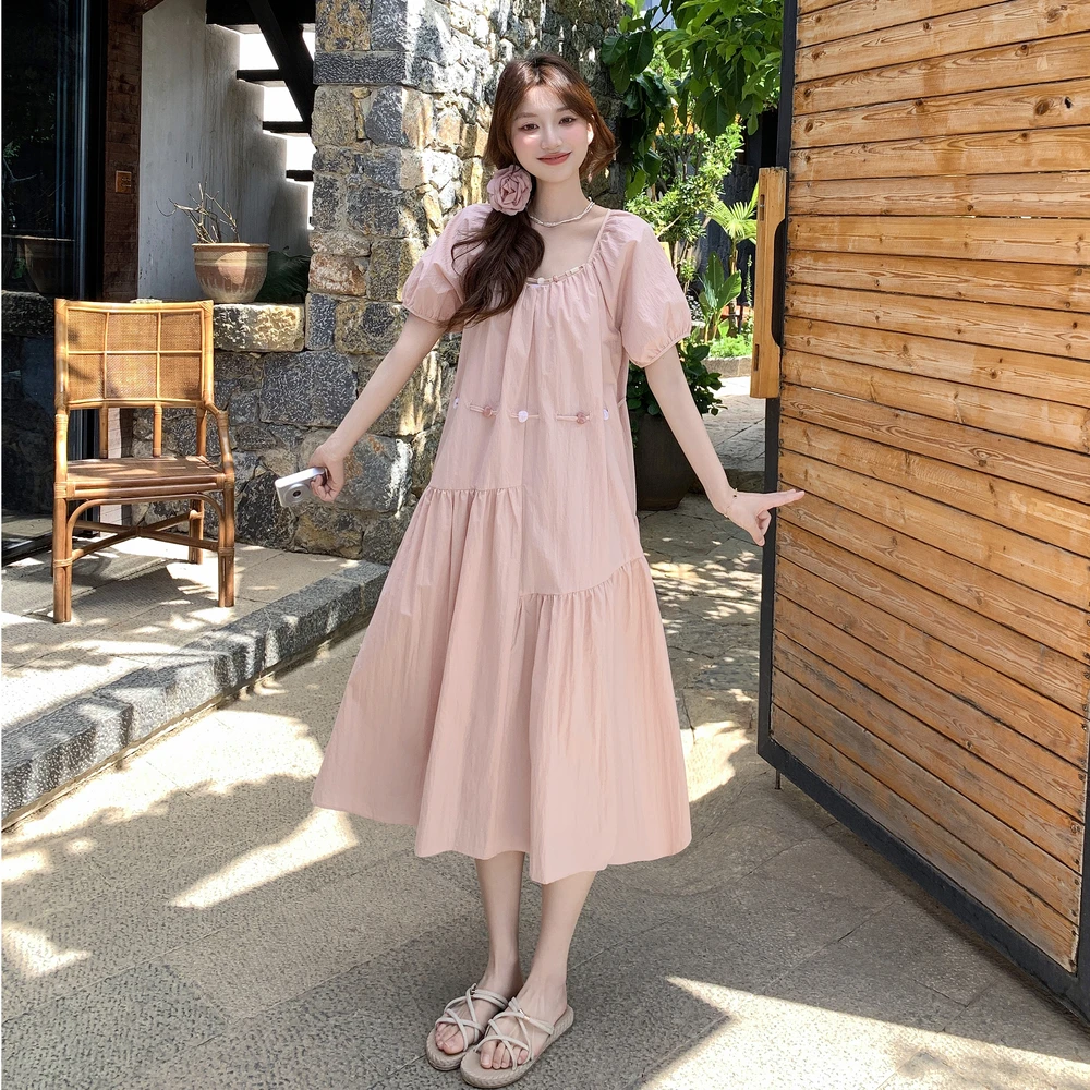 气质减龄粉色泡泡袖连衣裙女2025夏季新款不规则拼接下摆宽松长裙