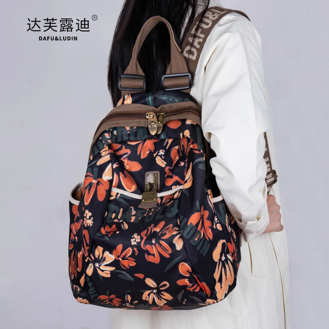 达芙露迪秋季新款复古琥珀流光风通勤轻便防水透气时尚女士背包