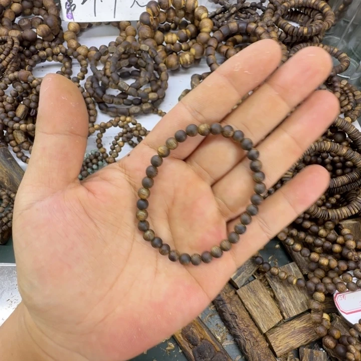 宸***真沉香沉香碎屑奇楠沉香凹身卡0.5单圈沉水34颗3克+